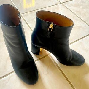 Tory Burch black leather ankle boots with Gold accent heel. 7.5 in great cond.